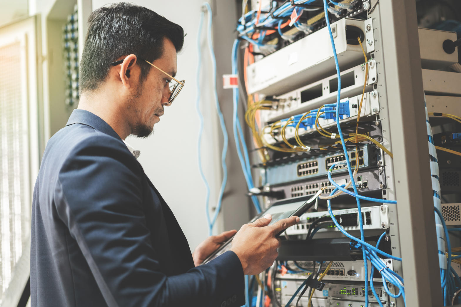 Technician at a network rack